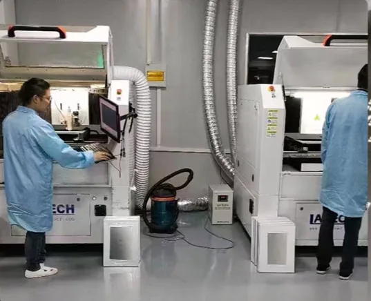 Two operators running the laser cutting machines