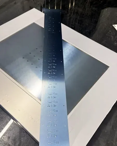 Nano-coated stainless steel stencil foil standing on a rack