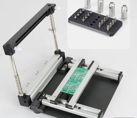 Frameless stencil printing table: a PCB clamped on the spring-loaded sled, with the locating jigs shown alongside